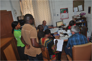 Father Anselm and his Cooperative Inquiry Group in his office at Pax Herbals
